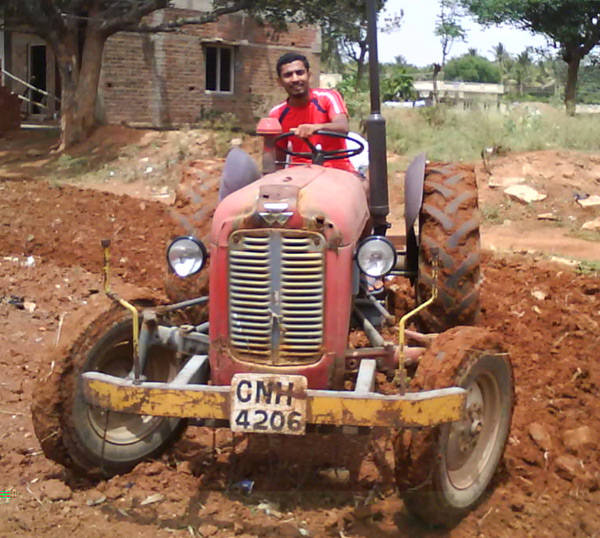 Social Worker Soma Shekar with his Tractor during Agriculture